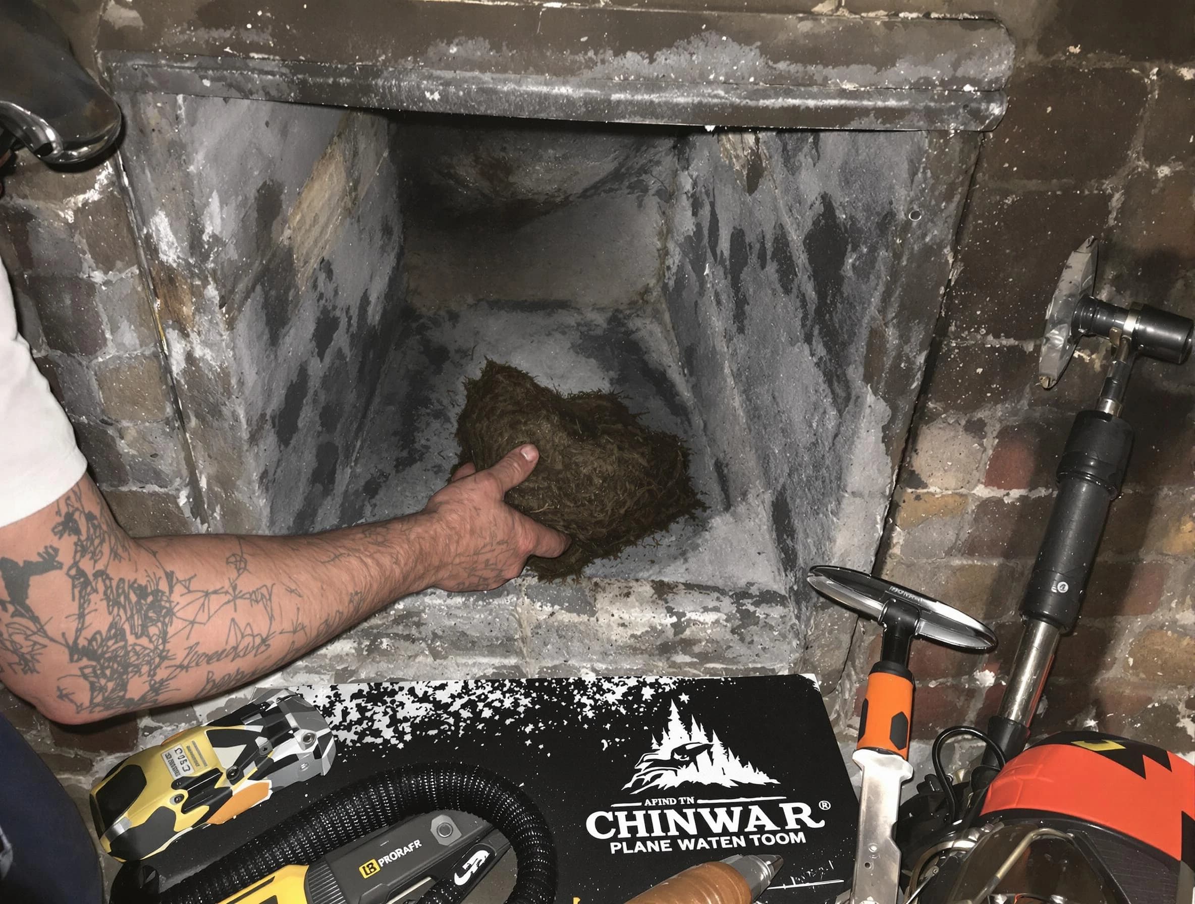 Palmetto Chimney Sweep safely removing debris and screening chimney in Palmetto, GA